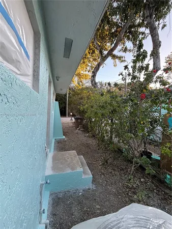 an empty room with a empty space and window