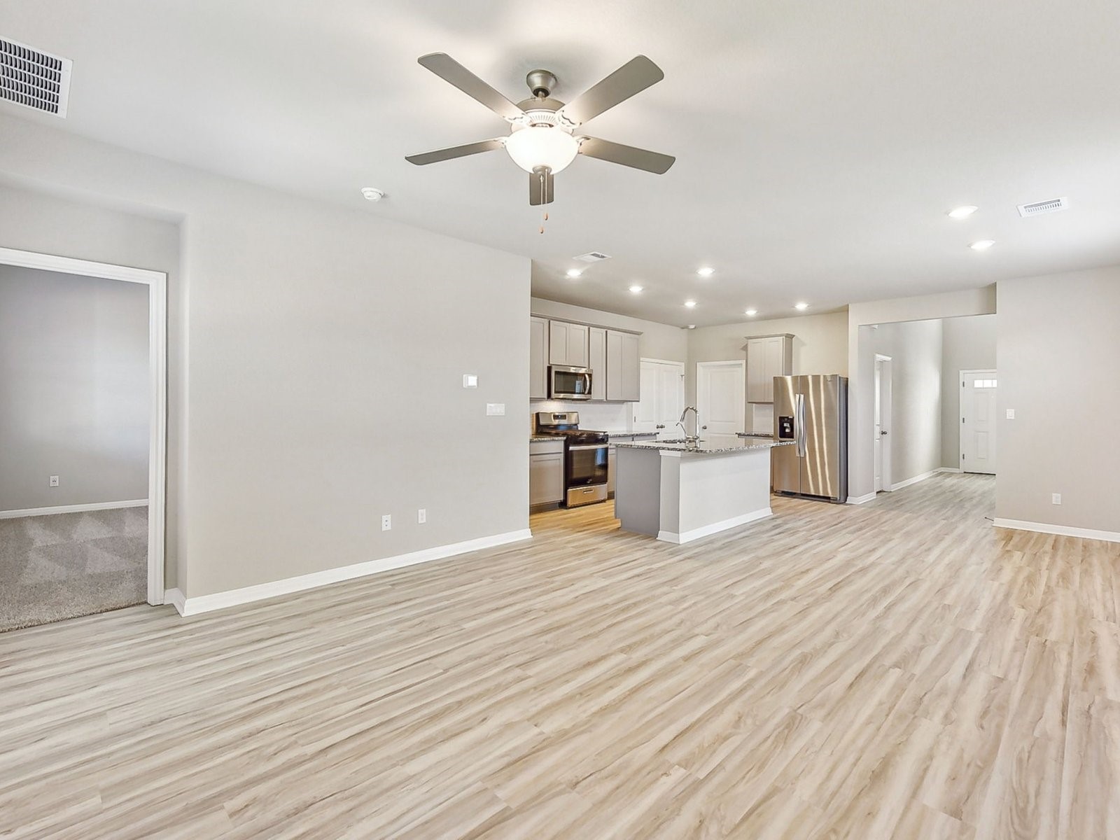 22631 Ellis Way New Caney, TX 77357 - Photo 2 of 13 a view of an empty room with wooden floor