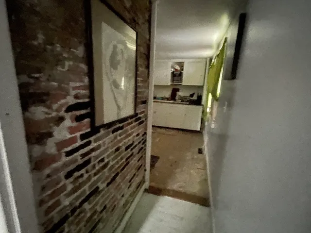 a kitchen with a sink and refrigerator