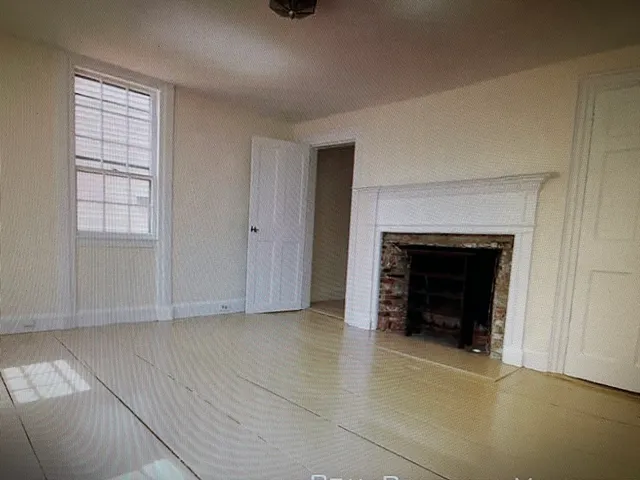 a kitchen with a refrigerator and a stove