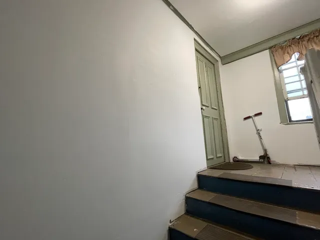 a view of staircase with wooden floor