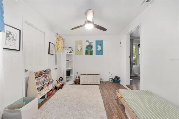 a view of walk in closet with clothes
