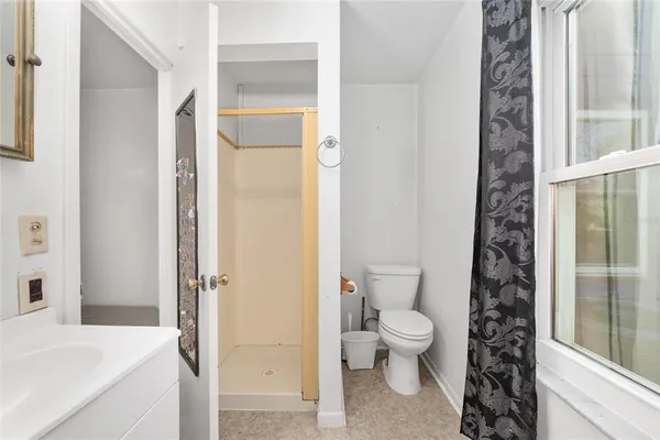 a bedroom with a bed and furniture