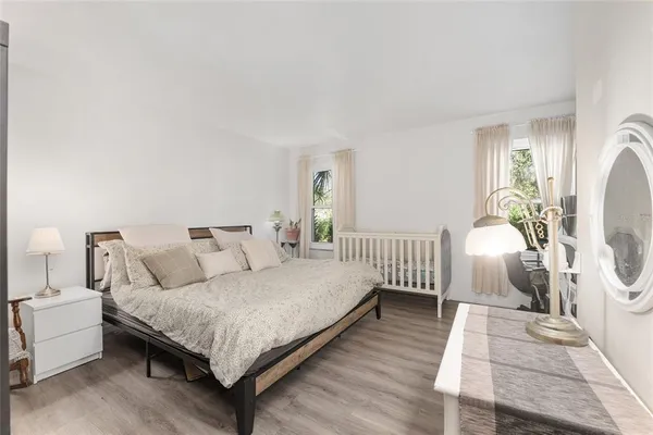 a backyard of a house with garden and outdoor seating