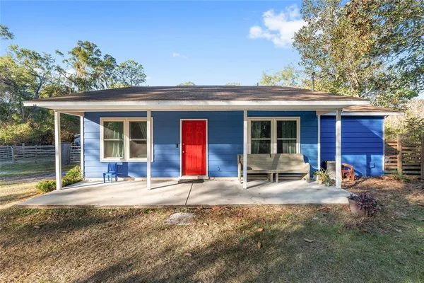 a house with trees in the background