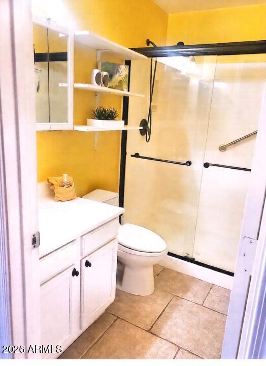 11058 East Cholla Road Mesa, AZ 85207 - Photo 12 of 22 a bathroom with a toilet a sink and a shower