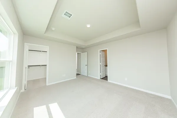 an empty room with closet area