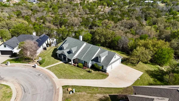 an aerial view of a house with outdoor space