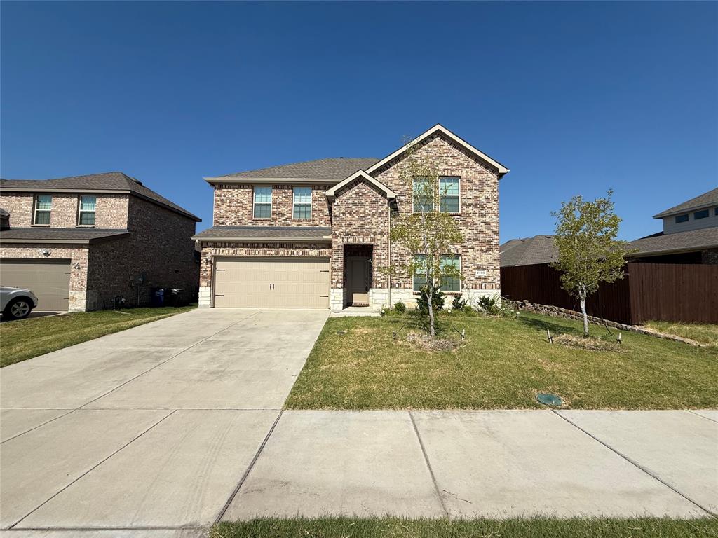 1400 Colonial Bluff Lane Princeton, TX 75407 - Photo 1 of 27 a front view of a house with garden