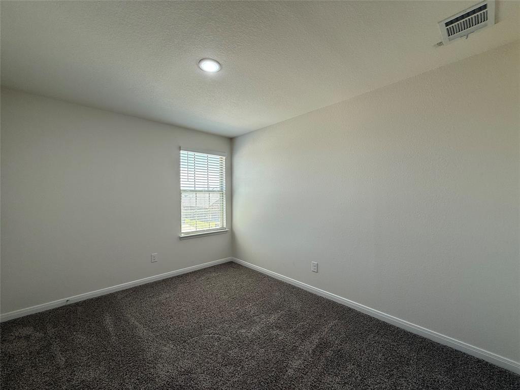 1400 Colonial Bluff Lane Princeton, TX 75407 - Photo 15 of 27 an empty room with a window