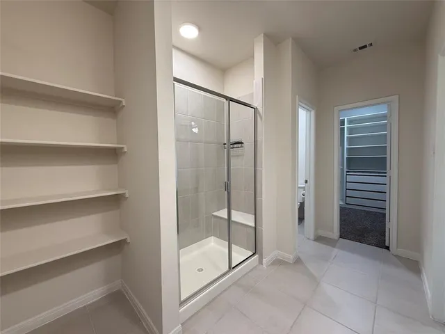 a view of a bathroom with shower