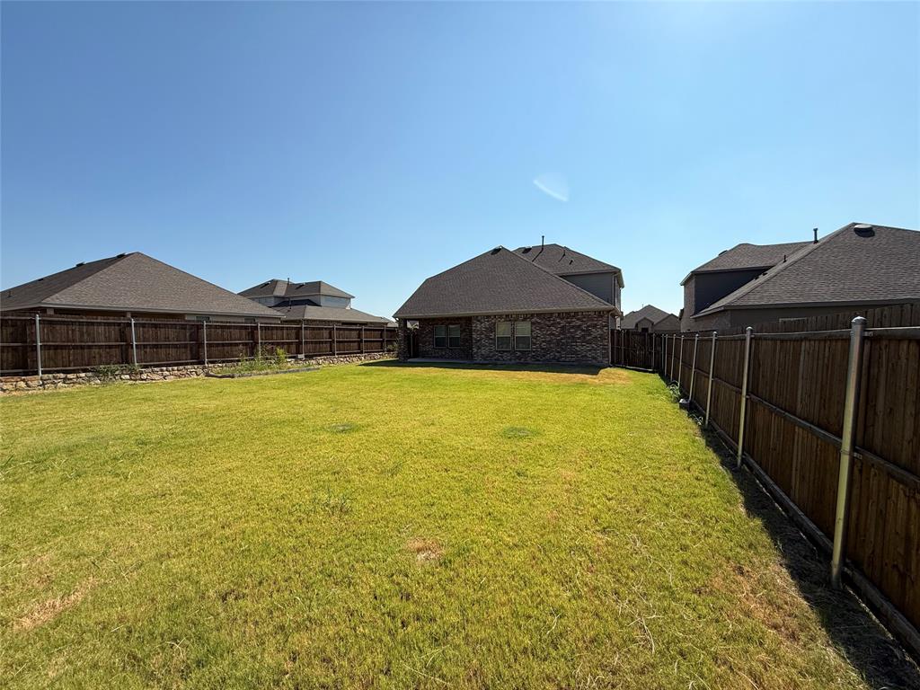 1400 Colonial Bluff Lane Princeton, TX 75407 - Photo 27 of 27 a front view of house with yard and patio