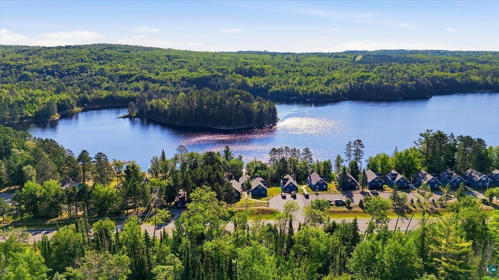 6266 Giants Ridge Road Biwabik, MN 55705 - Photo 4 of 29 Expansive waterfront property featuring a large lake and surrounding natural landscape