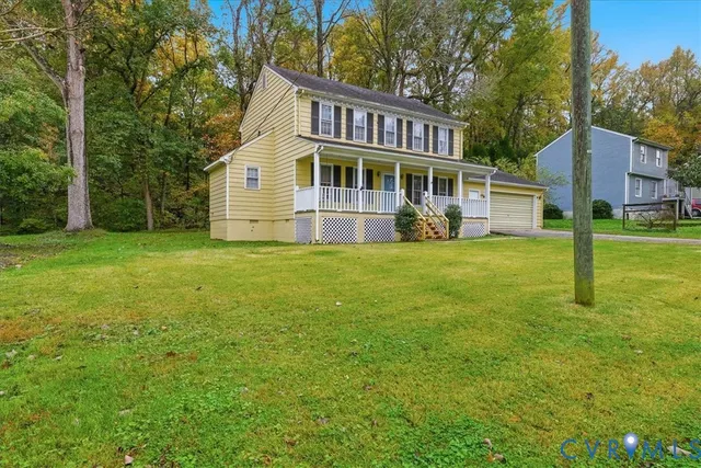 a view of a house with a big yard