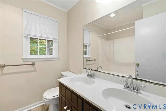 a bathroom with a sink toilet and vanity