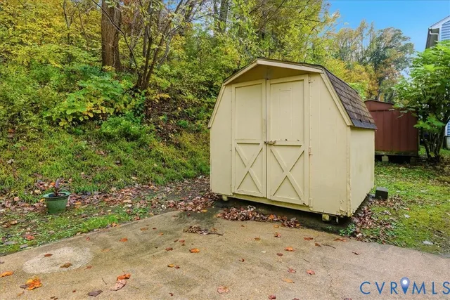 a view of a wooden house with a yard