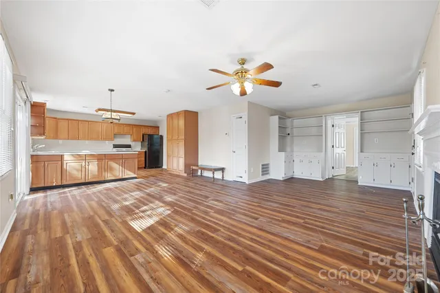 a kitchen with stainless steel appliances granite countertop a stove and a sink