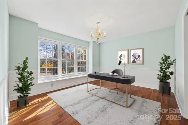 a living room with furniture a dining table and chairs