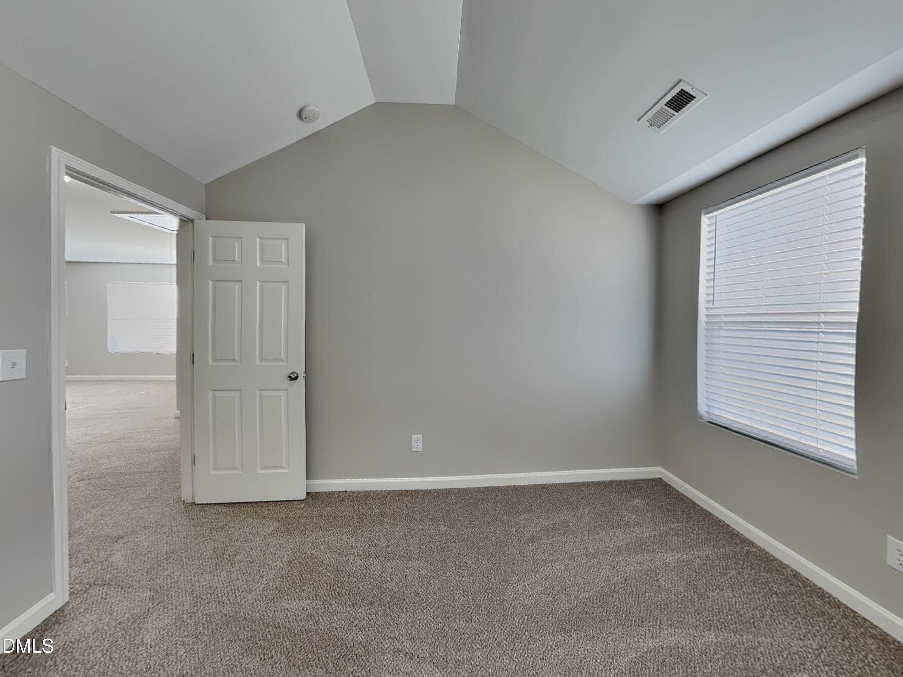 1609 Extine Lane Raleigh, NC 27610 - Photo 12 of 18 a view of an empty room with a window