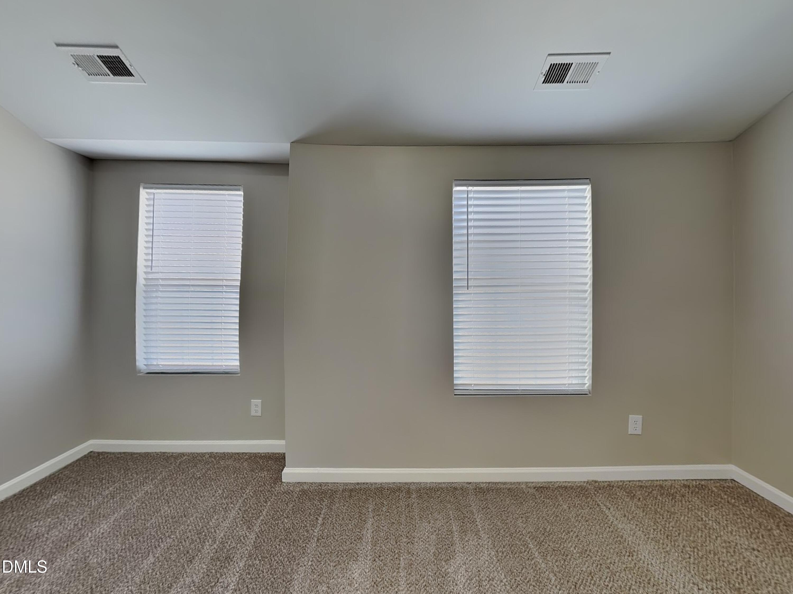 1609 Extine Lane Raleigh, NC 27610 - Photo 13 of 18 an empty room with a window