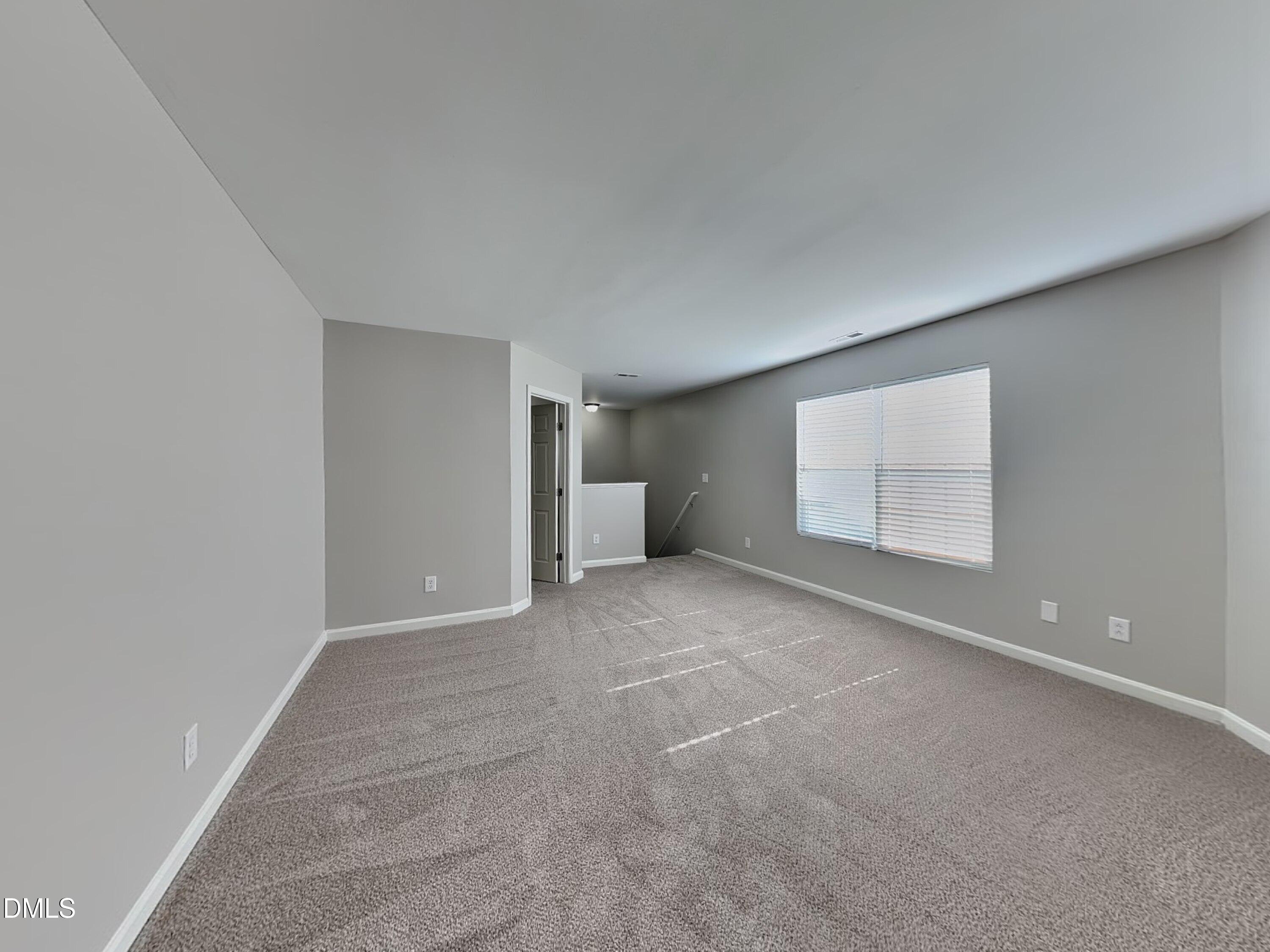 1609 Extine Lane Raleigh, NC 27610 - Photo 16 of 18 a view of an empty room with a window