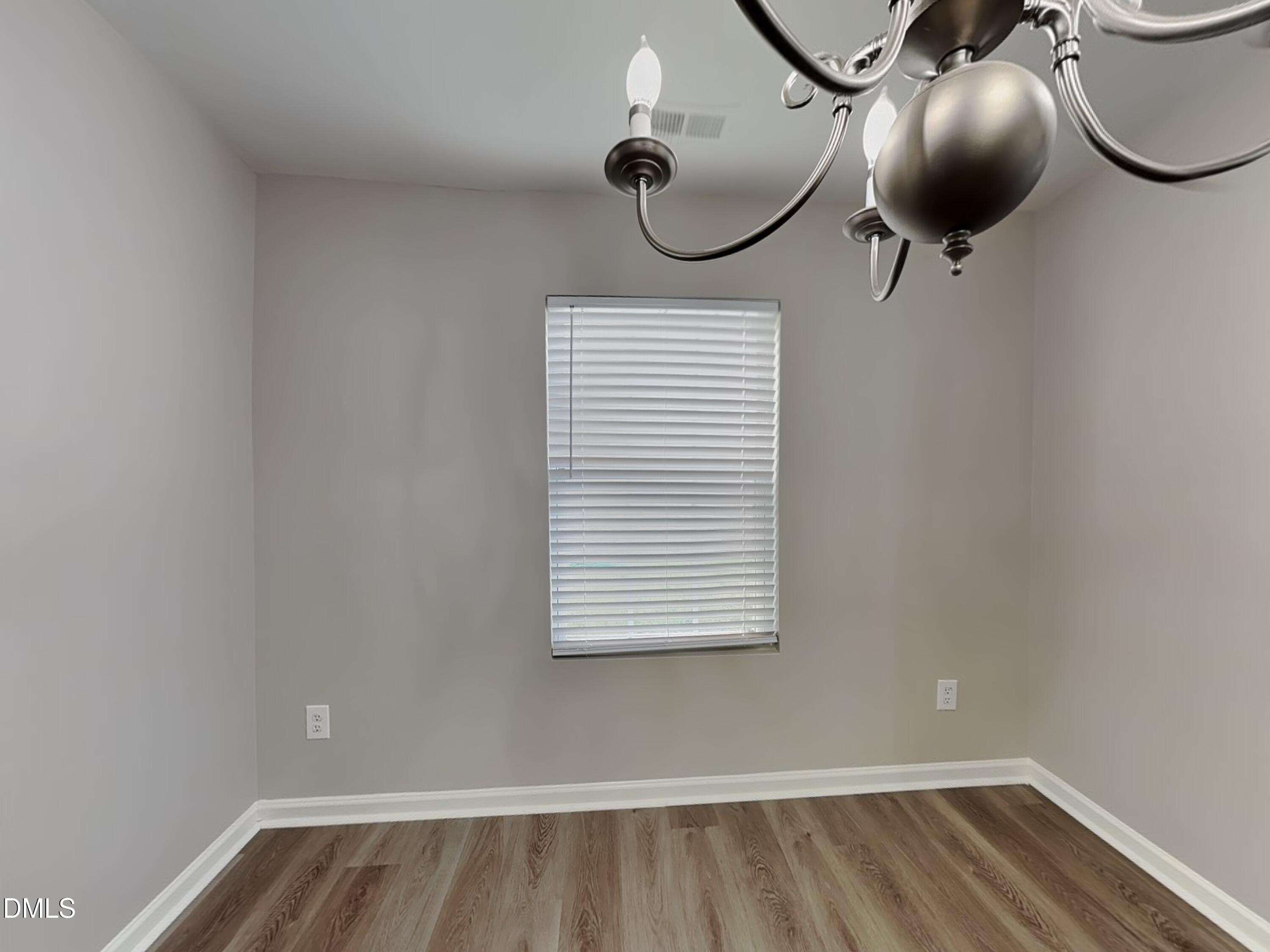 1609 Extine Lane Raleigh, NC 27610 - Photo 3 of 18 a bathroom with a sink and a mirror