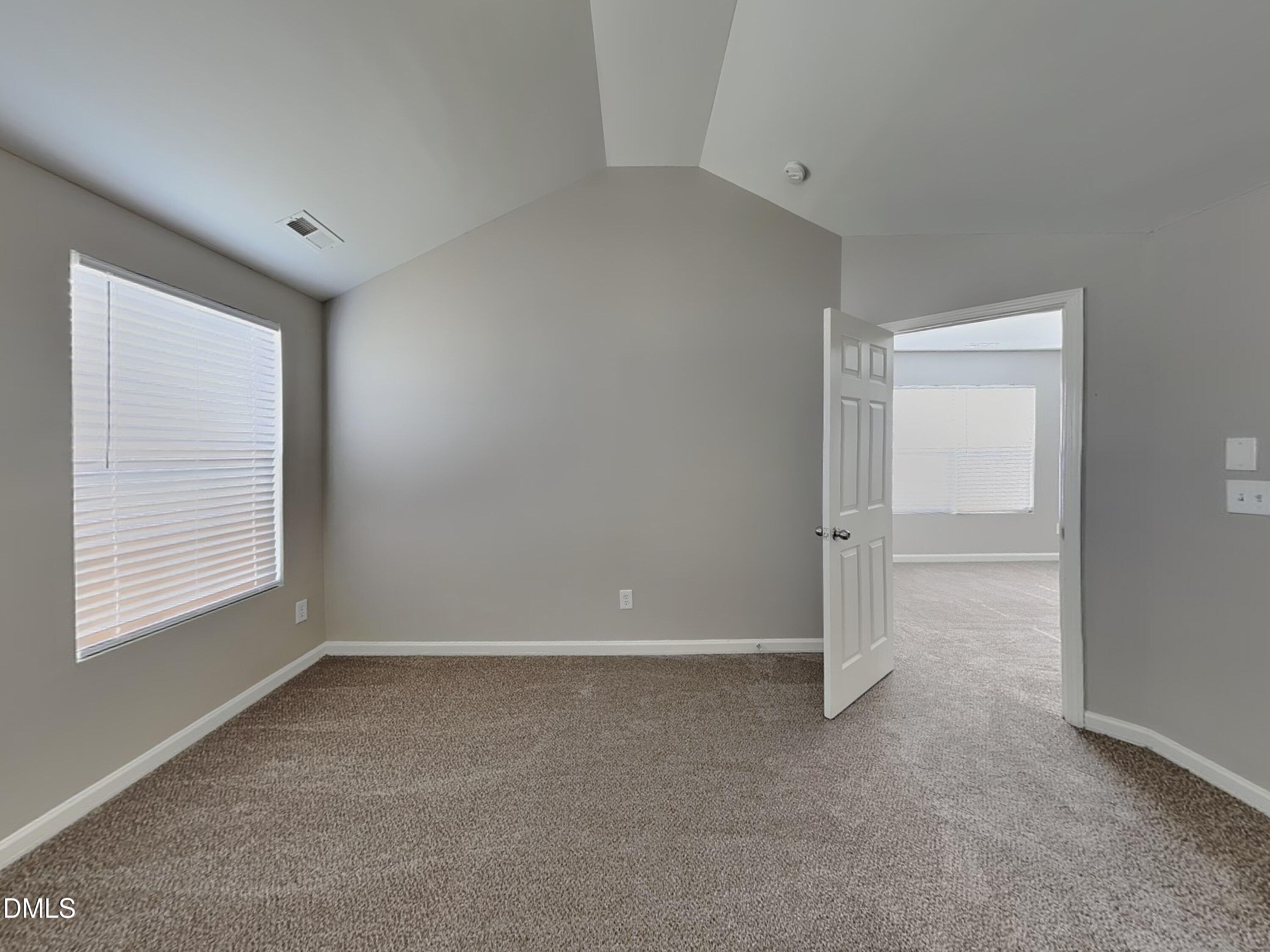 1609 Extine Lane Raleigh, NC 27610 - Photo 6 of 18 a view of an empty room with a window