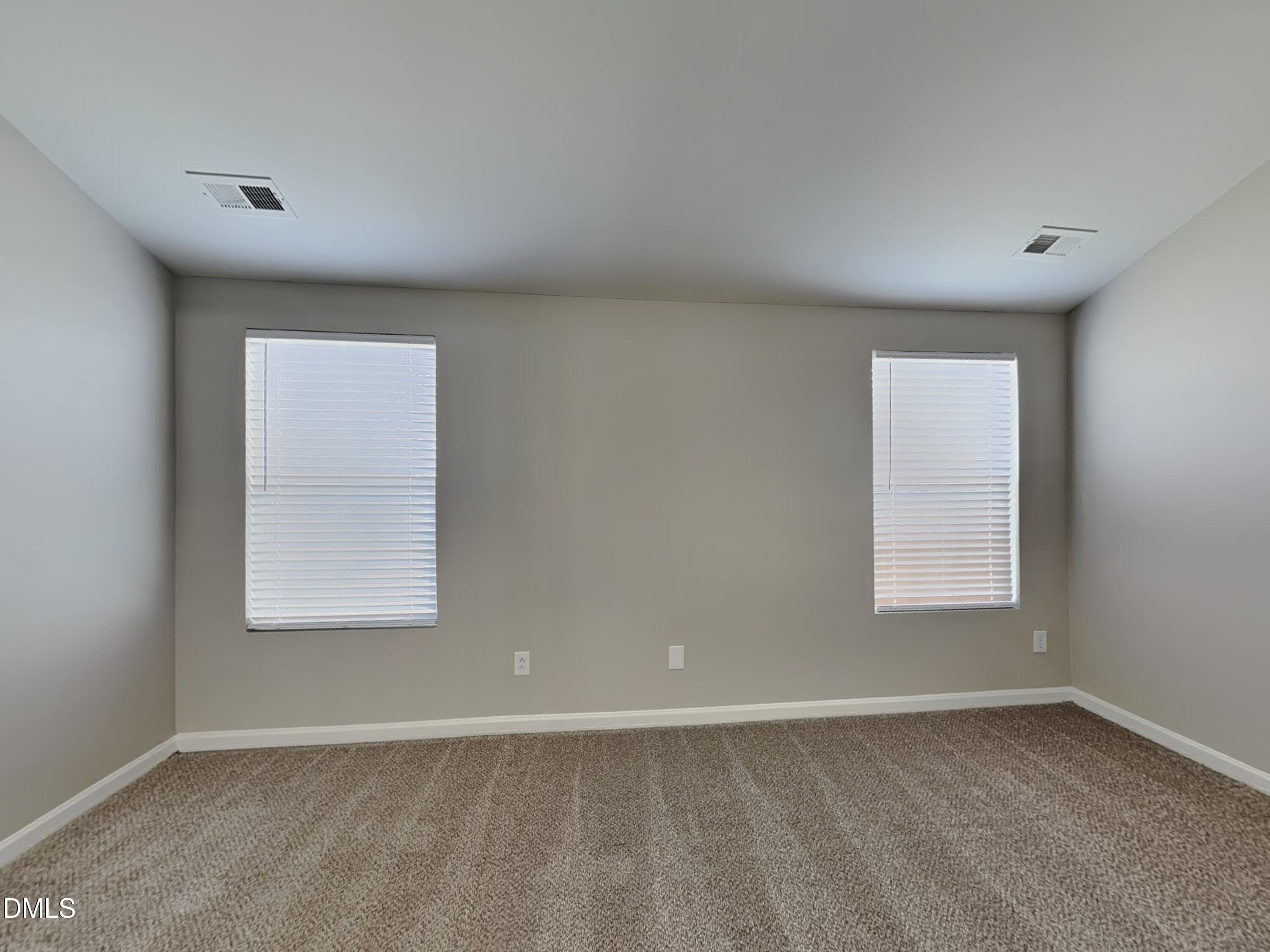 1609 Extine Lane Raleigh, NC 27610 - Photo 7 of 18 an empty room with a window