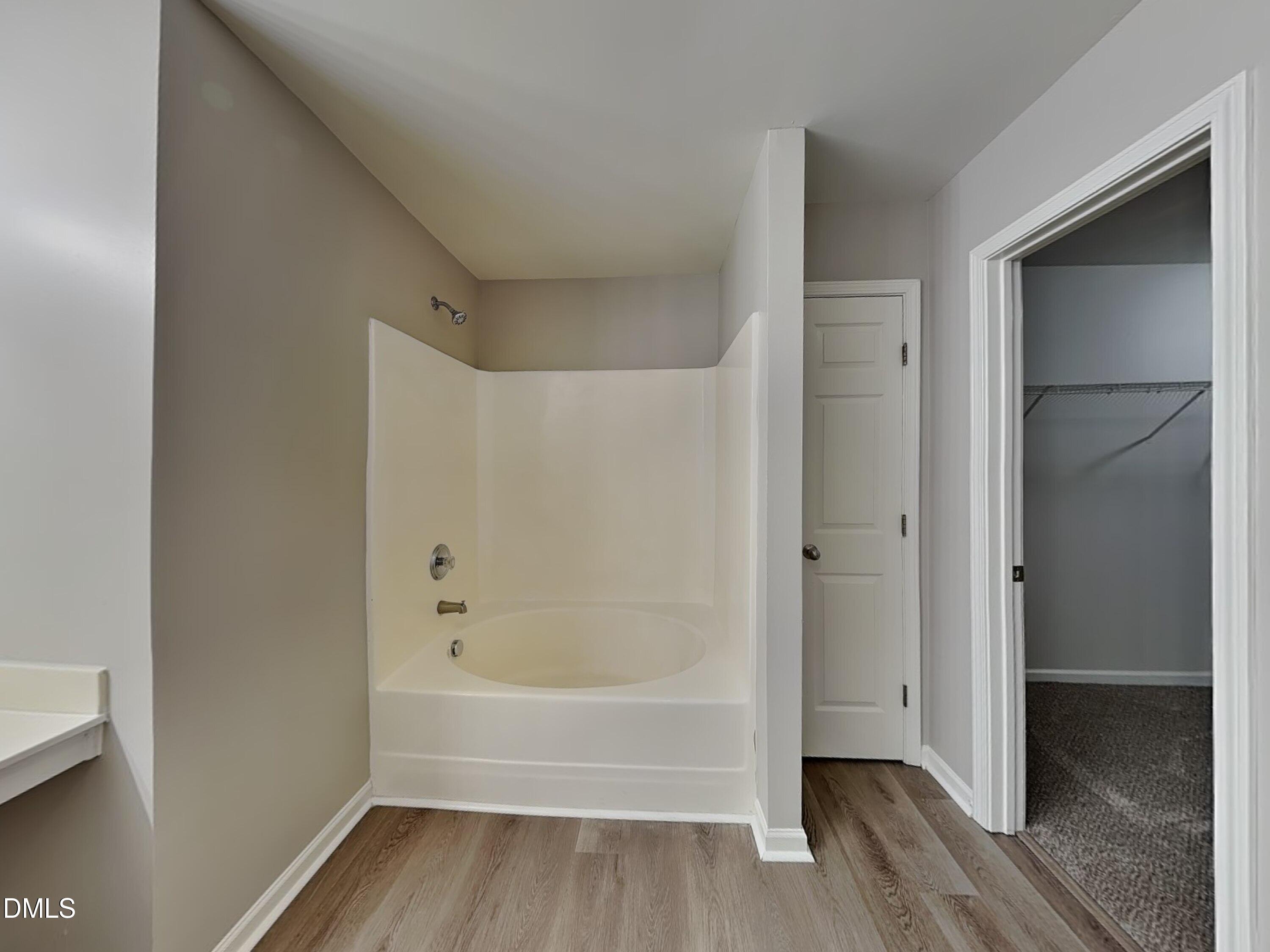 1609 Extine Lane Raleigh, NC 27610 - Photo 9 of 18 a bathroom with a bathtub and a shower