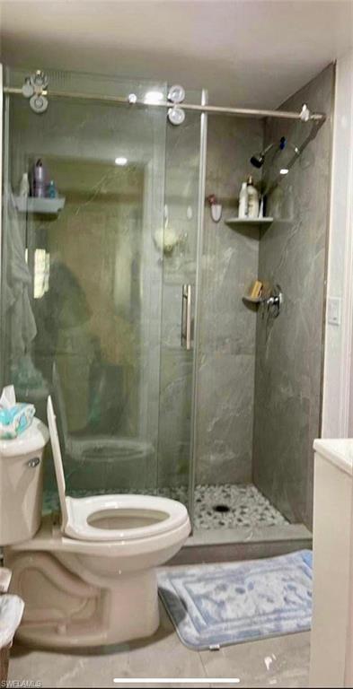 3770 25th Avenue Southwest Naples, FL 34117 - Photo 14 of 15 a bathroom with a toilet and a shower