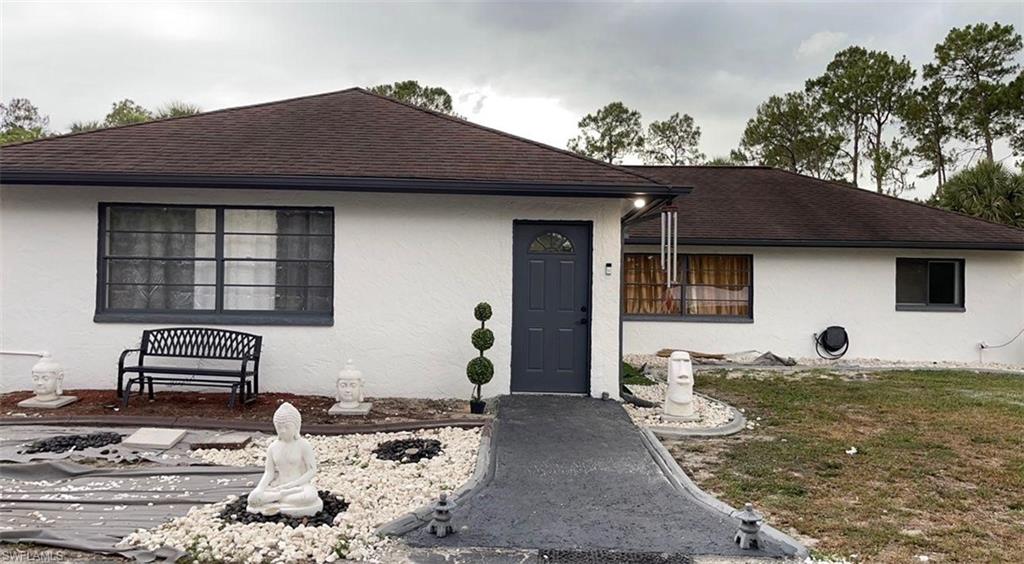 3770 25th Avenue Southwest Naples, FL 34117 - Photo 2 of 15 a backyard of a house with barbeque oven