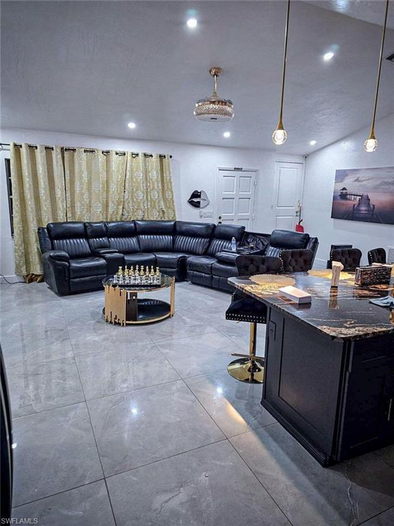 3770 25th Avenue Southwest Naples, FL 34117 - Photo 4 of 15 a kitchen with a sink a counter top space and a window