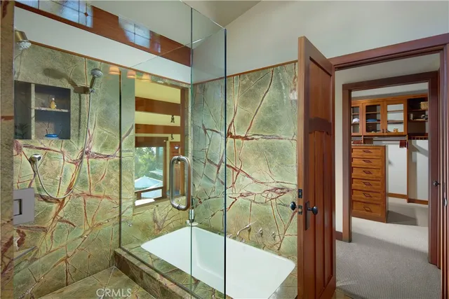 a bathroom with a tub and shower