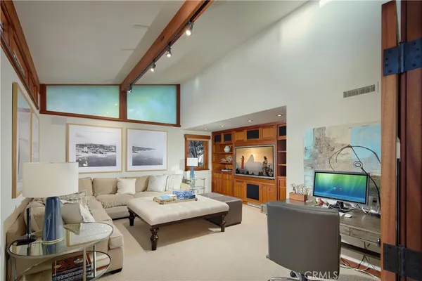 a spacious bedroom with a bed and a couch