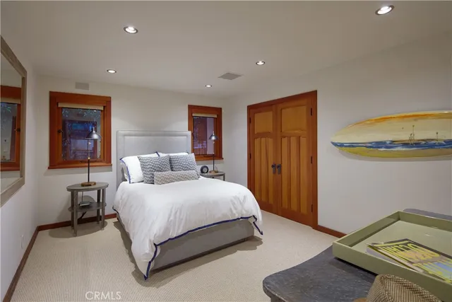 a spacious bedroom with a bed and a couch