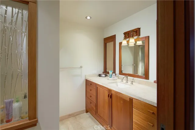 a bathroom with a double vanity sink and a mirror