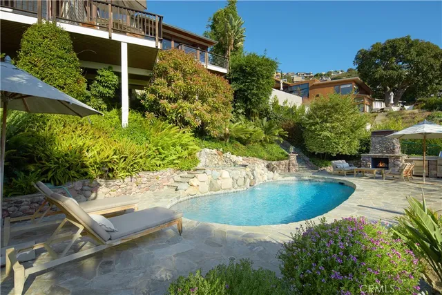 a view of a patio with iron fence