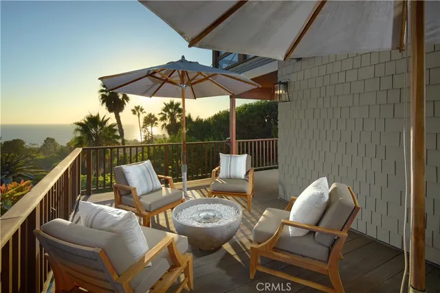 a patio with patio couch and chairs