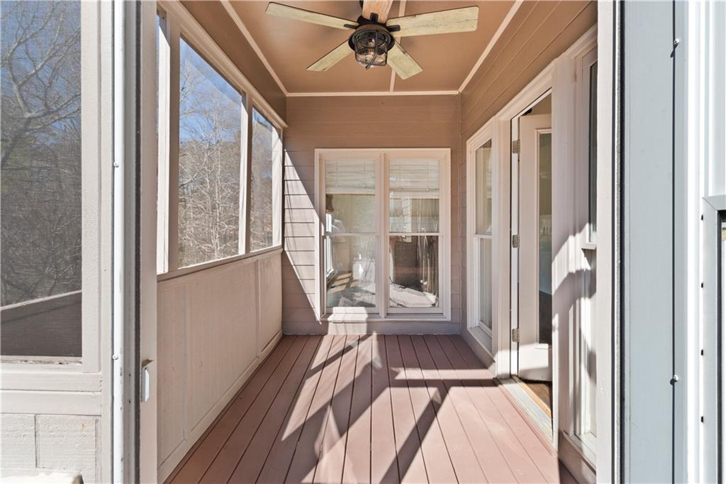 325 Morning Mist Walk Suwanee, GA 30024 - Photo 14 of 67 a view of a hallway with a dining table and chairs