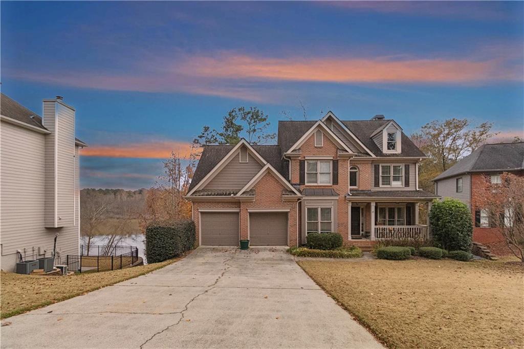 325 Morning Mist Walk Suwanee, GA 30024 - Photo 2 of 67 a front view of a house with a yard