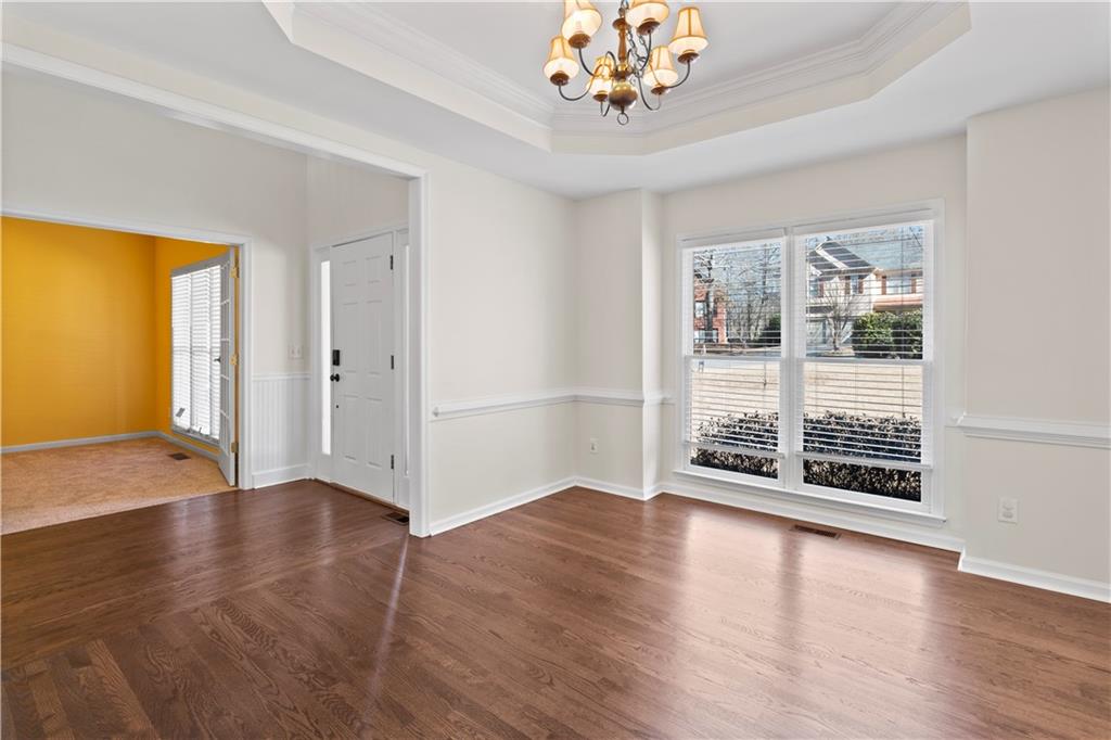 325 Morning Mist Walk Suwanee, GA 30024 - Photo 33 of 67 a view of an empty room with wooden floor and a window
