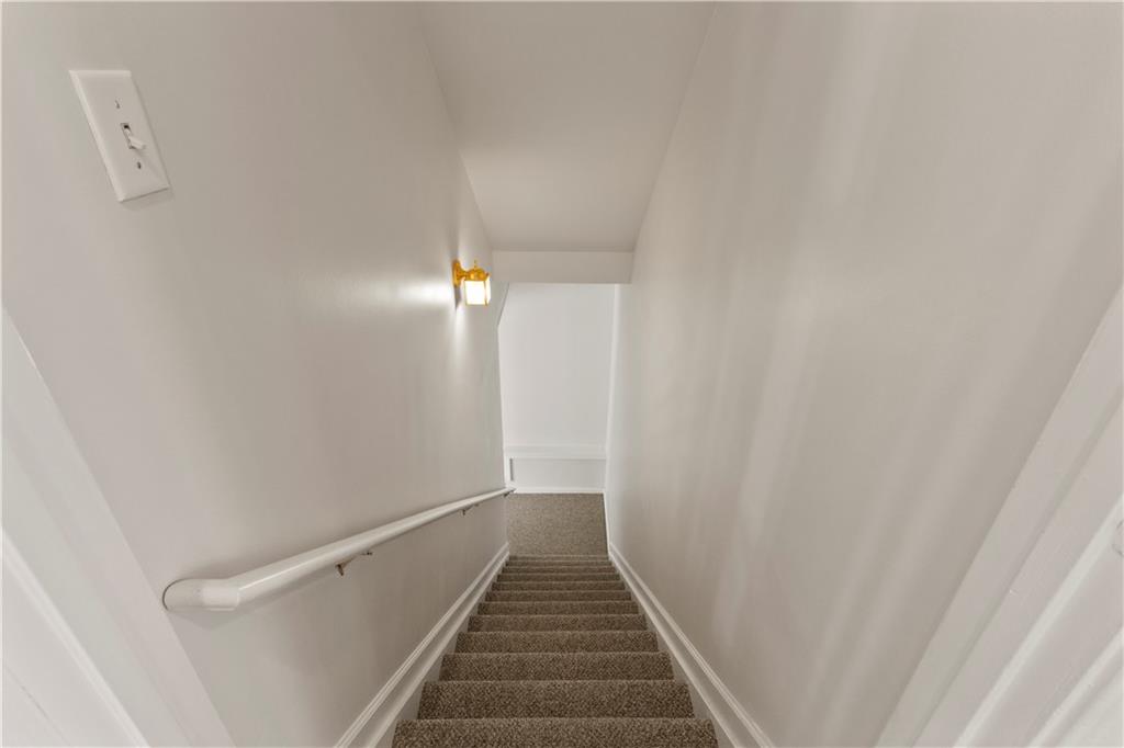 325 Morning Mist Walk Suwanee, GA 30024 - Photo 37 of 67 a view of a hallway with stairs