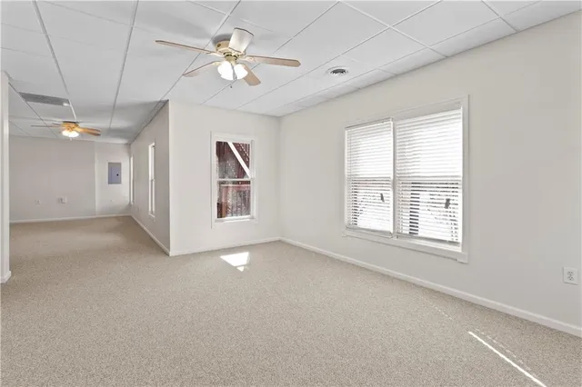 a aerial view of a house with a yard