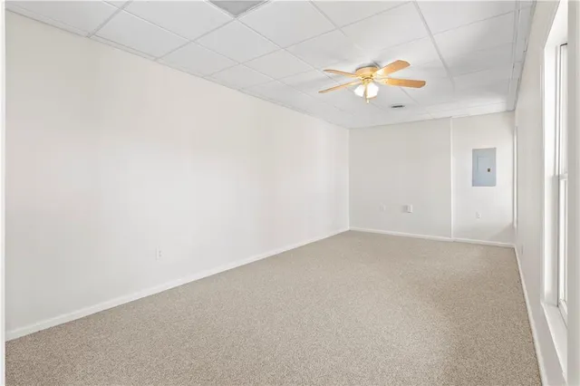 a aerial view of a house with a yard