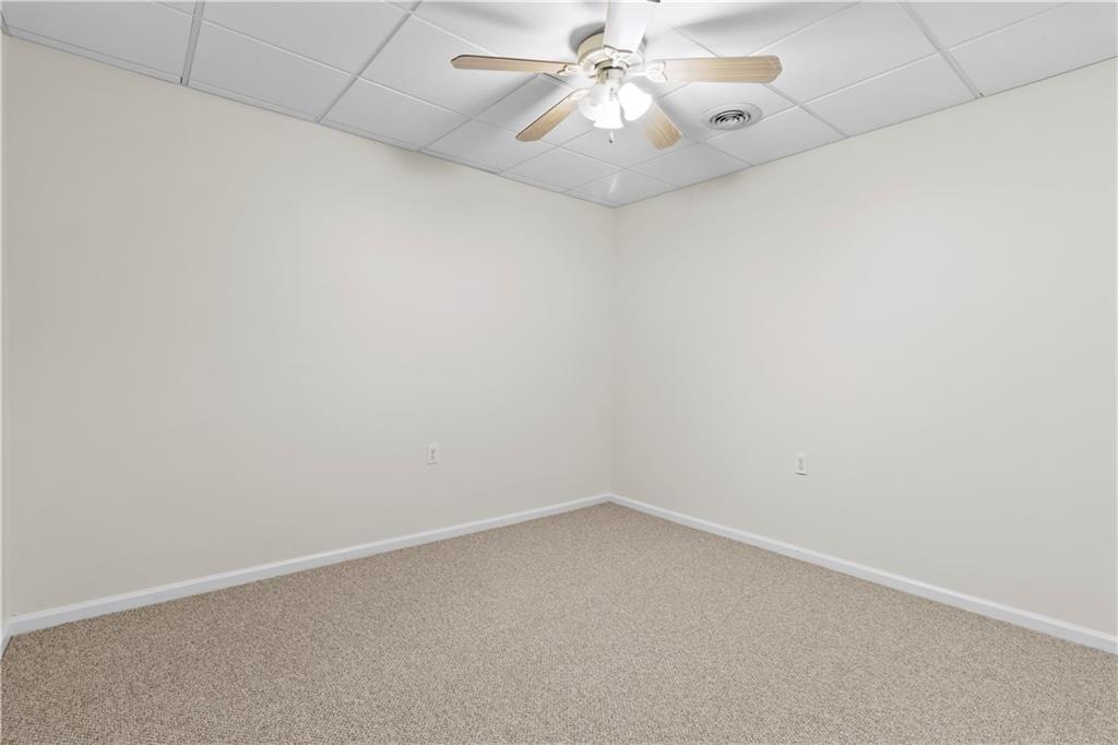 325 Morning Mist Walk Suwanee, GA 30024 - Photo 45 of 67 an empty room with a window and a fan