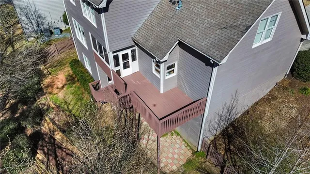 an aerial view of multiple houses with yard