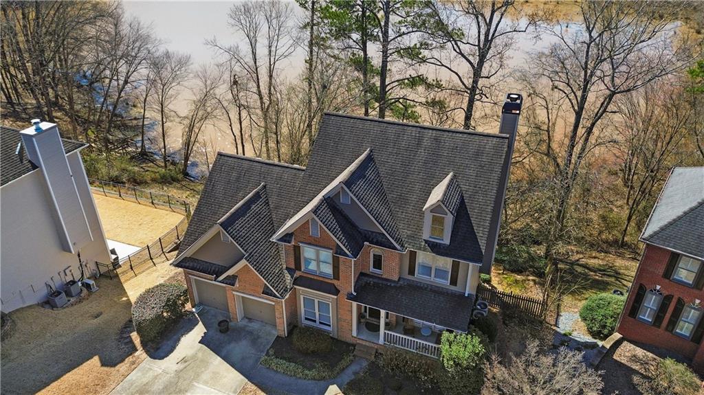 325 Morning Mist Walk Suwanee, GA 30024 - Photo 52 of 67 a aerial view of a house with a yard