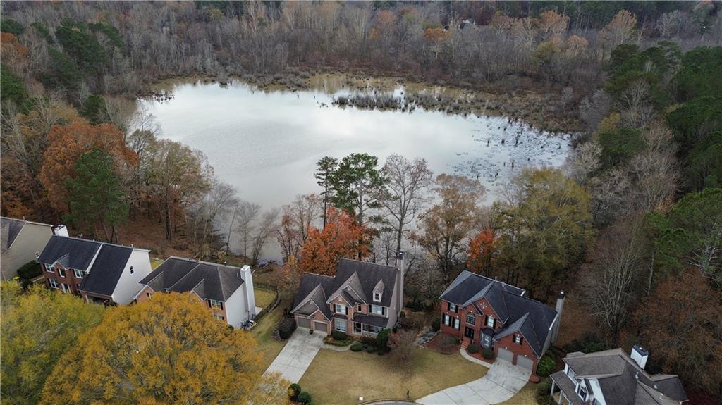 325 Morning Mist Walk Suwanee, GA 30024 - Photo 58 of 67 a view of a lake from a yard
