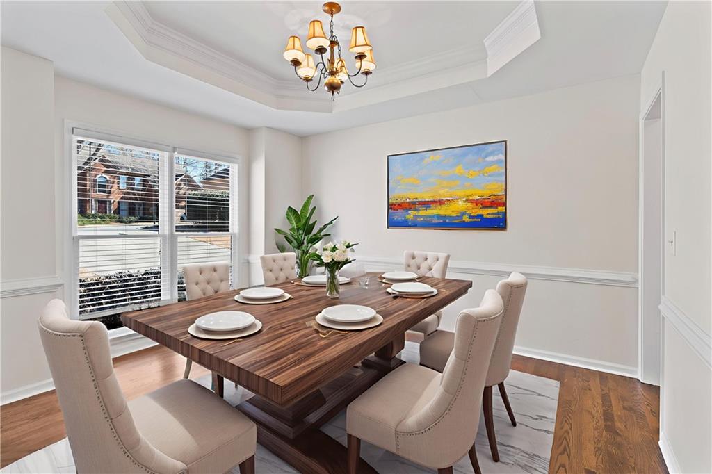 325 Morning Mist Walk Suwanee, GA 30024 - Photo 6 of 67 a view of a dining room with furniture window and wooden floor