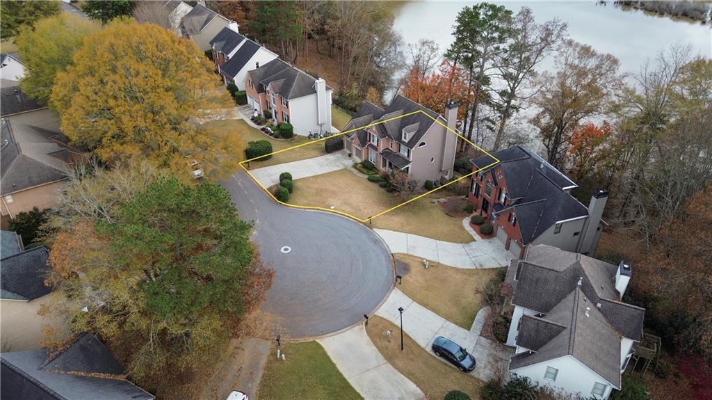 325 Morning Mist Walk Suwanee, GA 30024 - Photo 65 of 67 an aerial view of a house with outdoor space and a lake view